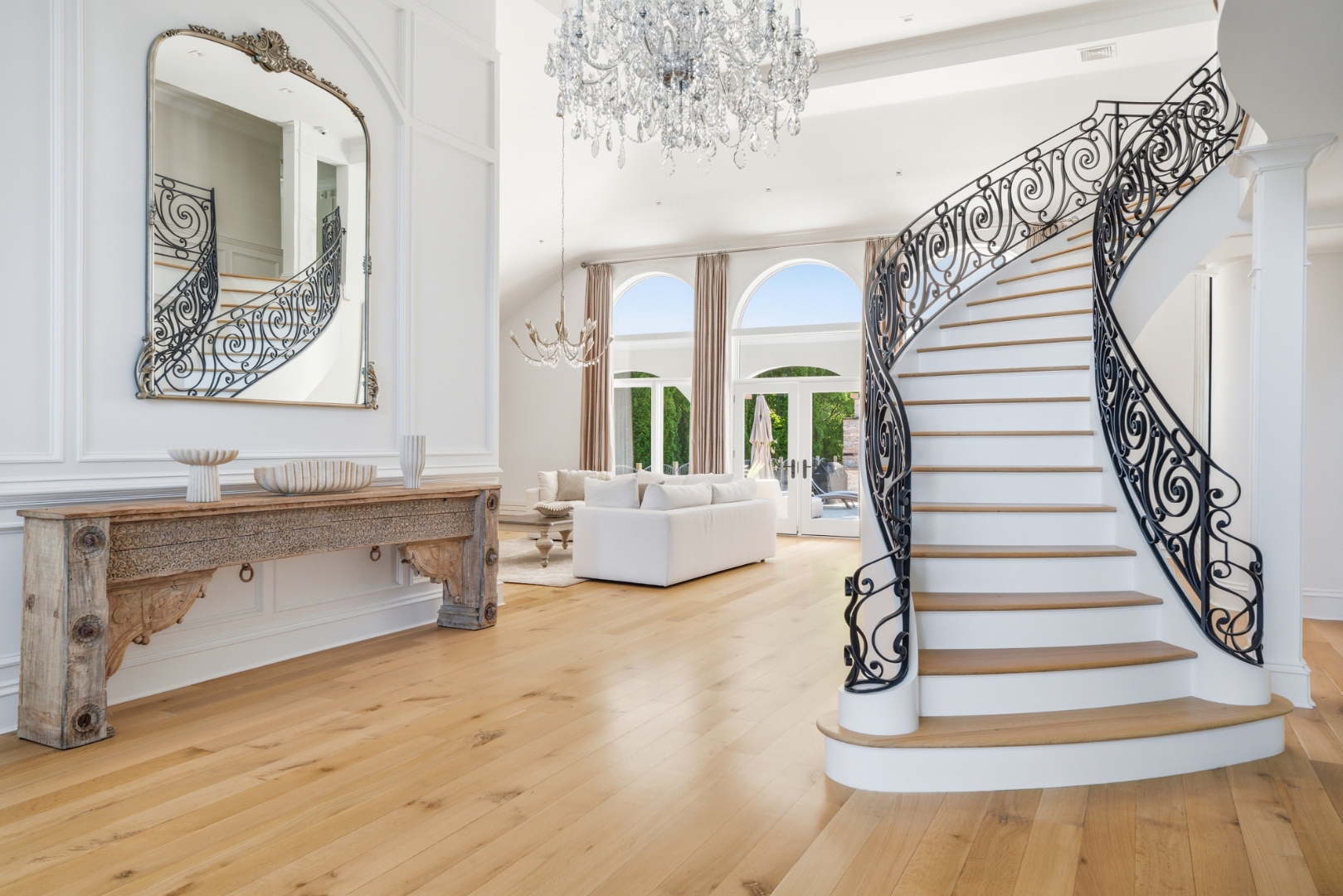 Foyer — paneled walls and hardwood floors