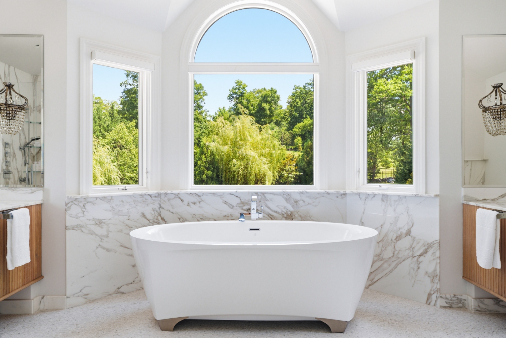 Primary bath with soaking tub, skylight and glass shower