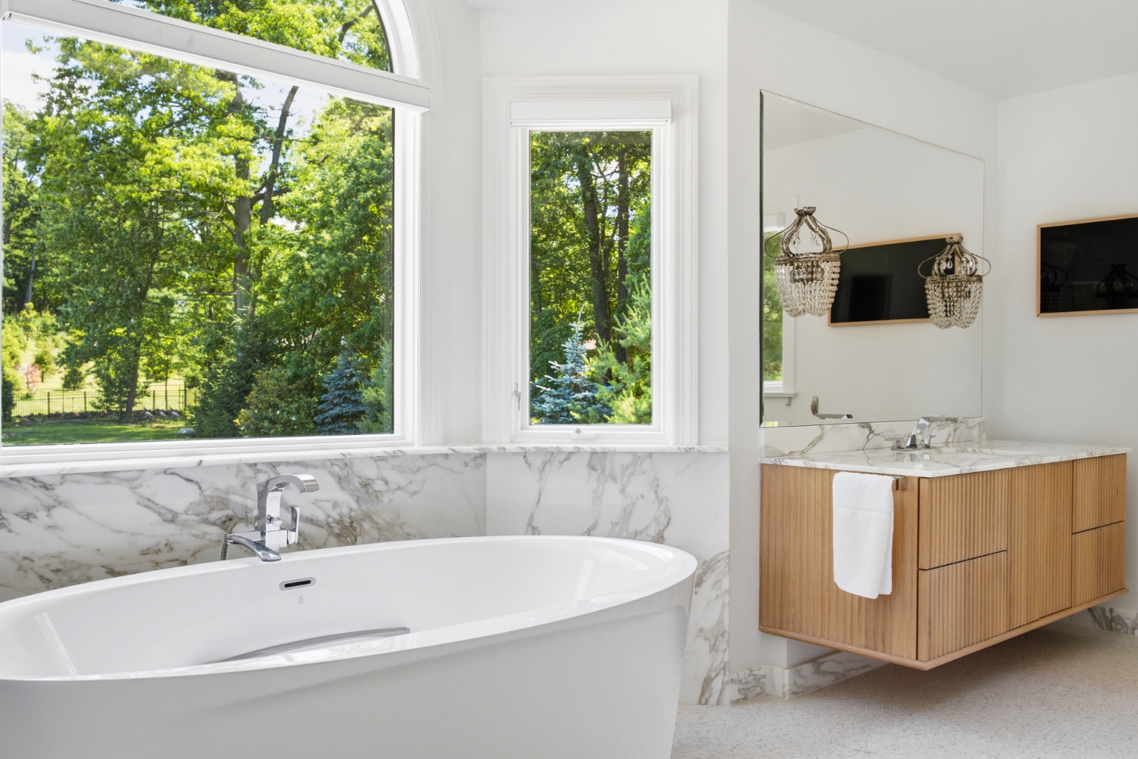 Primary bath — Marble and floating vanities