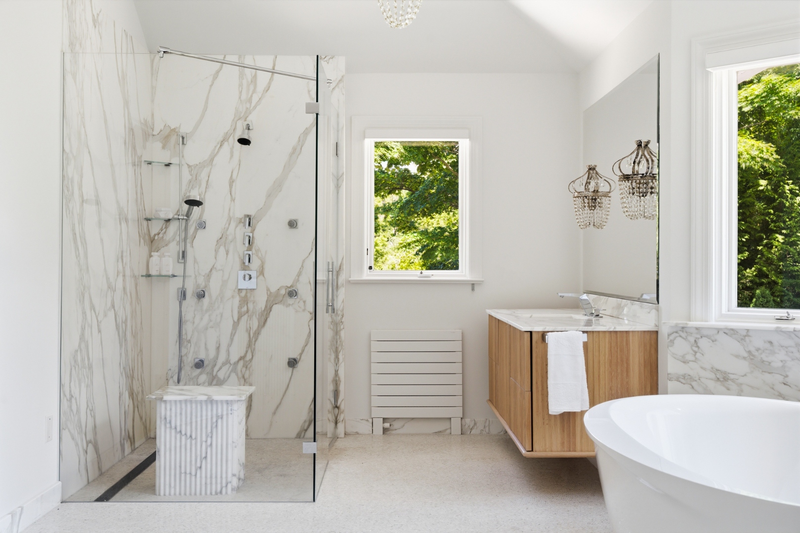Primary bath — slab shower with mosaic accents